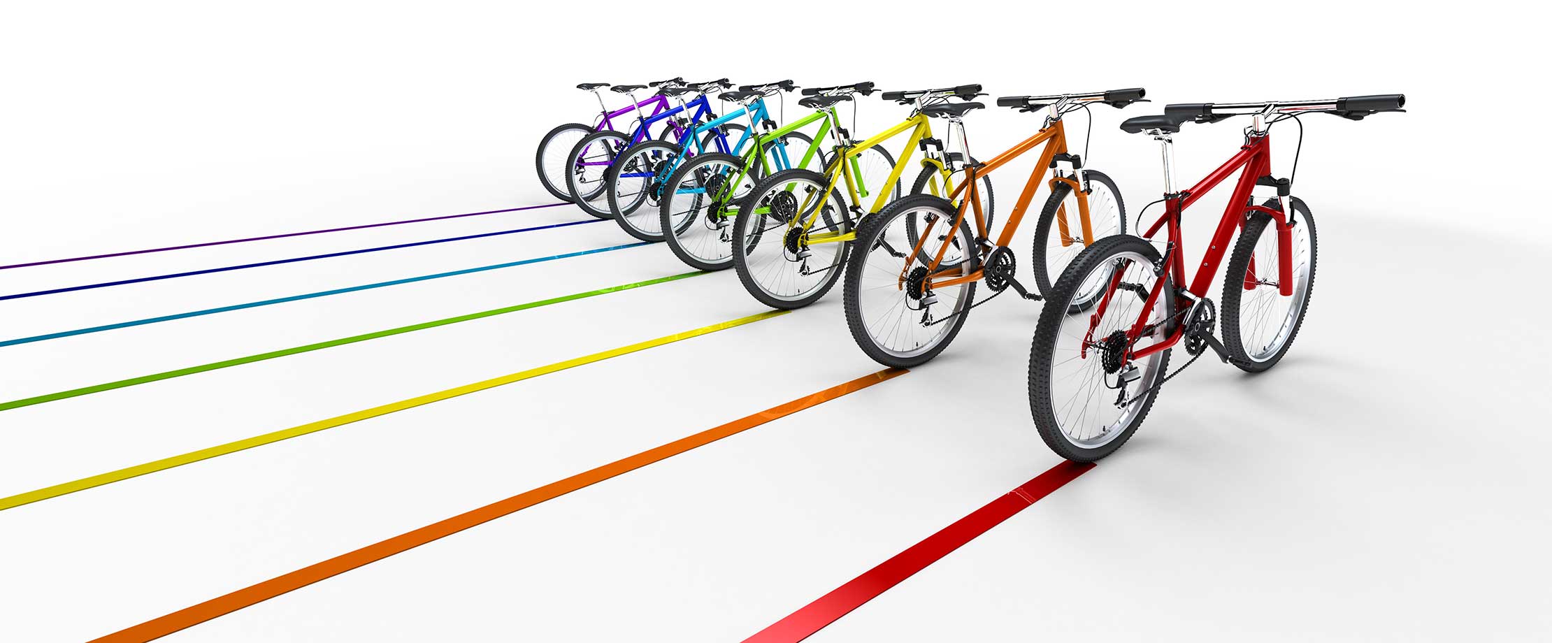 Hintereinanderstehende Fahrräder in den Regenbogenfarben fahren schräg nach hinten und ziehen bunte Spuren nach sich.